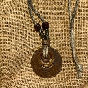 Post apocalyptic industrial hardware necklace on a distressed hemp cord